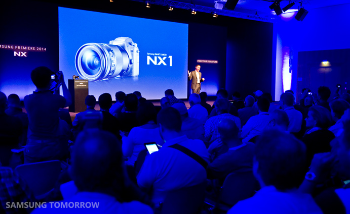Malcom Andre, Product Manager at Samsung Europe, giving product presentation at Samsung premier event - NX at Photokina 2014 